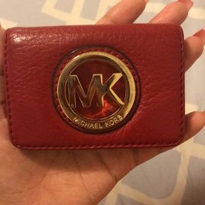 Tiny red MK wallet